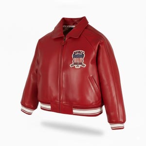 May include: A red leather jacket with a white and red striped hem and cuffs. The jacket has a collar, a zipper closure, and a patch on the chest with the word "AVIREX" and an American flag design.