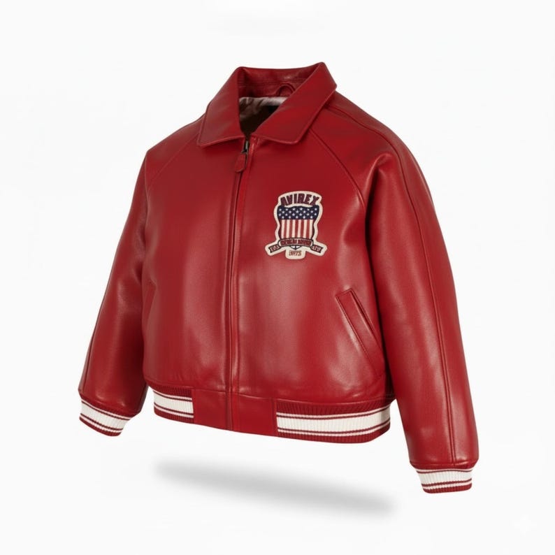 May include: A red leather jacket with a white and red striped hem and cuffs. The jacket has a collar, a zipper closure, and a patch on the chest with the word "AVIREX" and an American flag design.