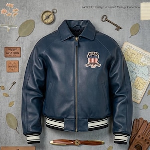 May include: A navy blue leather jacket with a zip closure, a collar, and a chest patch. The jacket features a white and black striped hem and cuffs. The image includes vintage aviation-themed accessories.