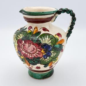 May include: A rustic wooden sign with the text "Welcome to our home" in white lettering. The sign features a distressed finish and a simple, inviting design, perfect for a front porch or entryway.