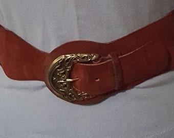 Vintage red suede and elastic belt with gold fancy buckle 35" to 39" long 3" wide