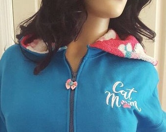 Cat Mom hoodie in turquoise with embroidered design and coordinated pockets and hood lining size Medium ready to ship