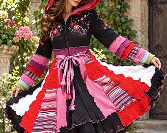 May include: A long-sleeved hooded coat featuring a black bodice with floral embroidery, a front zipper, and a tie waist. The flared skirt and sleeves are constructed from multi-colored, layered knit fabric panels in shades of red, pink, and white.