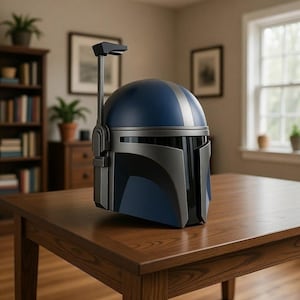 May include: A blue and gray Mandalorian helmet with a silver stripe on top. The helmet is made of a hard material and has a visor. It is sitting on a brown wooden table.