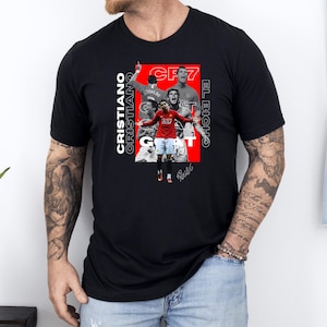 a man wearing a black shirt with a picture of a basketball player on it