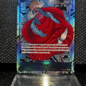 May include: A set of three ceramic mugs with a speckled, matte finish. The mugs are in shades of cream, light gray, and dark gray. Each mug has a simple, minimalist design and a rounded handle.