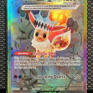 May include: Holographic Eevee EX Pokémon card with a colorful design. The card features an illustration of Eevee with the text "Rainbow DNA" and "Coruscating Quartz". The card has a HP of 200 and is from the 167/131 set.