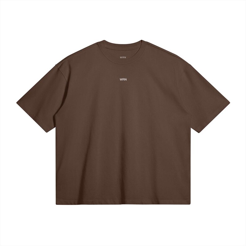 May include: A solid brown t-shirt with short sleeves. The shirt has a crew neck and the word "WRN" is printed in small white letters on the chest. The shirt is made of a soft material and is a basic wardrobe staple.