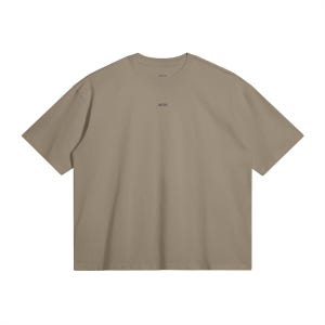 May include: A short-sleeved, taupe-colored t-shirt with a crew neck. The word "WRN" is printed in small, dark letters centered on the chest. The shirt has a relaxed fit and a minimalist design.