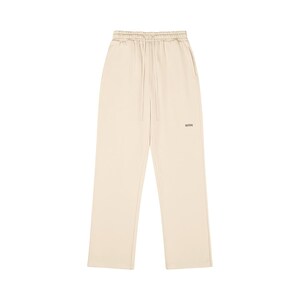 Pale beige sweatpants with a drawstring waist and a loose fit. The trousers feature a small "WRN" logo near the left pocket. The material looks soft and lightweight, ideal for casual wear.