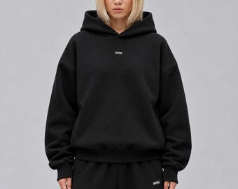 Sudadera con capucha de tejido grueso, 100 % algodón, felpa cepillada de 380 g/m², corte relajado con hombros caídos.