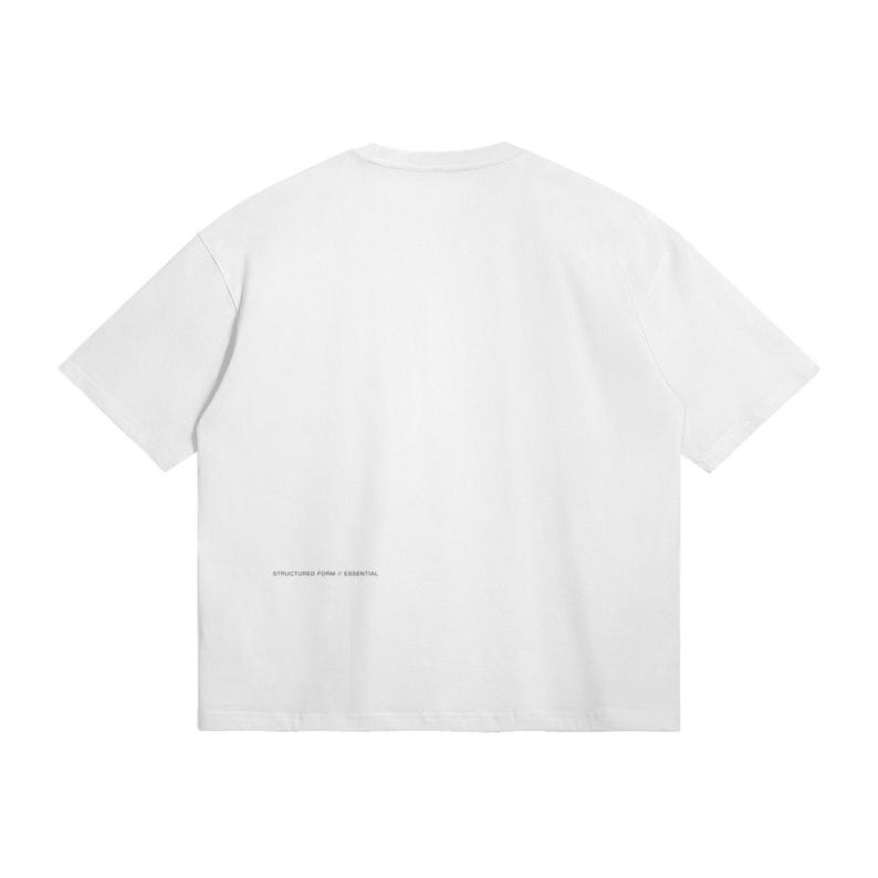 May include: A white t-shirt with short sleeves. The back of the shirt features the text "STRUCTURED FORM / ESSENTIAL" in a small, dark font near the bottom. The shirt has a relaxed fit.
