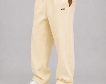 Pantalones deportivos gruesos, corte holgado de pierna abierta, 100 % algodón cepillado de 380 g/m², tejido neutro esencial, unisex.