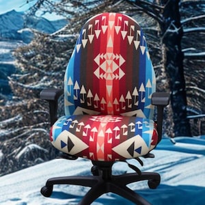 May include: An office chair with a colorful patterned design. The chair features a black base with wheels, armrests, and a backrest and seat covered in a geometric pattern of red, blue, and white shapes. The background shows a snowy mountain scene.