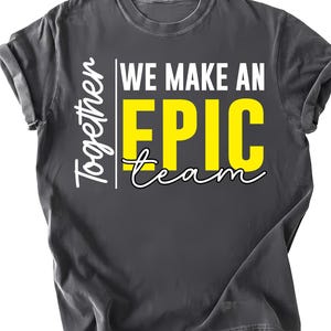 May include: Dark gray t-shirt with the text "Together We Make An EPIC team" in white and yellow. The shirt has a crew neck and short sleeves. The text is centered on the front of the shirt.