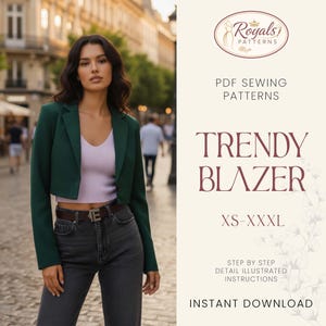 May include: A woman wearing a dark green cropped blazer, a light purple top, and dark gray jeans. The image includes text that reads "Trendy Blazer" and "XS-XXXL". The background is a blurred city street.