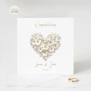 Personalized wedding card with gold foil finish, custom names and date shown in an AI-generated listing photo