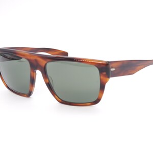 May include: Brown tortoiseshell sunglasses with rectangular frames and green lenses. The sunglasses have a classic design with a slightly curved top bar and thick temples. The lenses are a muted green color, offering a stylish look.