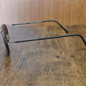 May include: A set of three ceramic vases in varying heights and shapes. The vases feature a matte white finish and a minimalist design, suitable for displaying flowers or as decorative objects. The tallest vase is approximately 10 inches high.