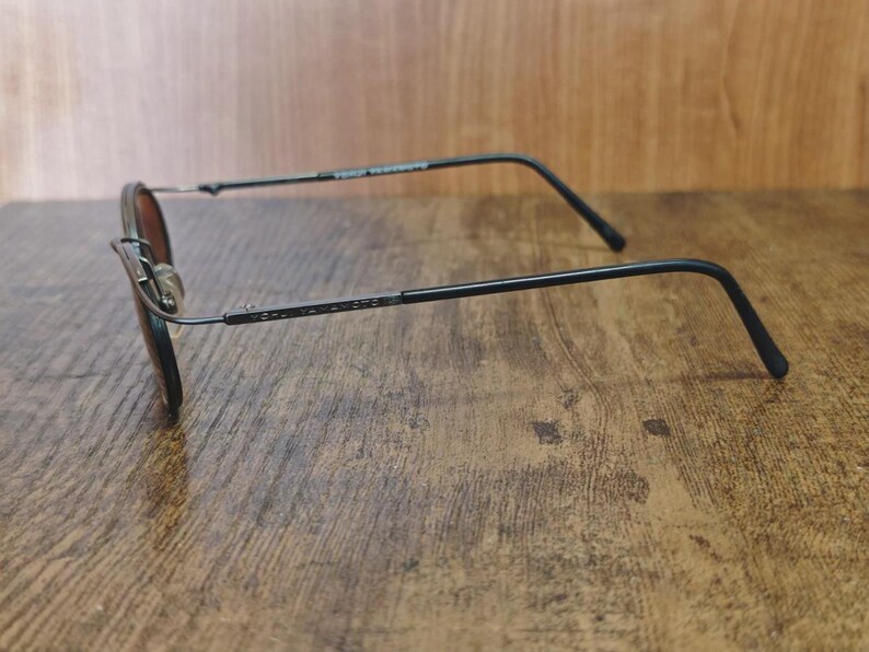 May include: A set of three ceramic vases in varying heights and shapes. The vases feature a matte white finish and a minimalist design, suitable for displaying flowers or as decorative objects. The tallest vase is approximately 10 inches high.