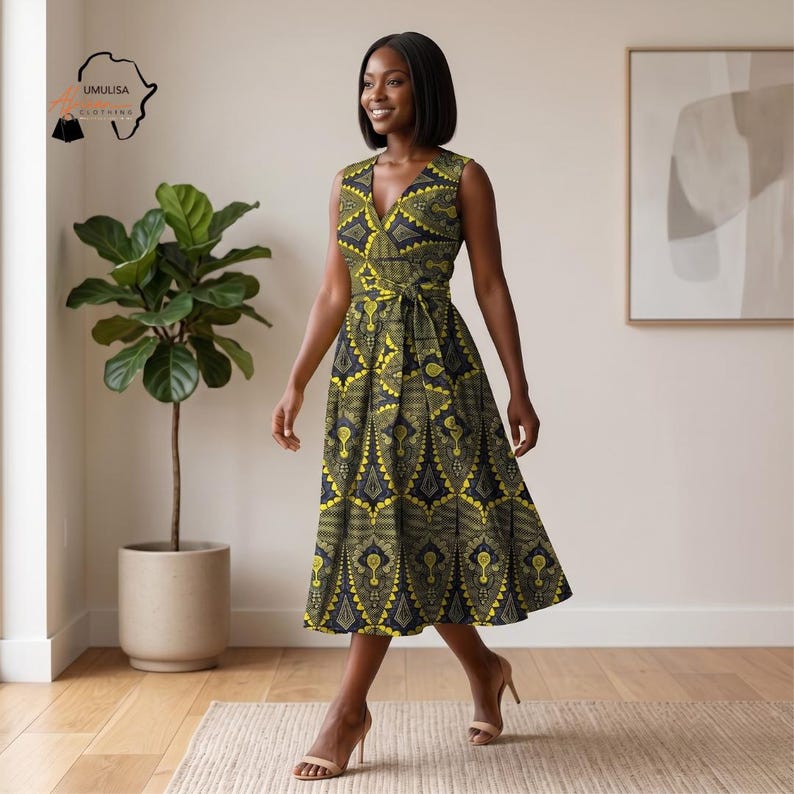 May include: A sleeveless wrap dress with a V-neck and a tie waist. The dress features a yellow and black geometric pattern. The dress is knee-length and has a flared skirt. The logo "UMULUSA CLOTHING" is in the upper left corner.