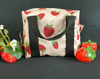 Strawberry bag can be used to store makeup, toiletries, art supplies, toys and books.