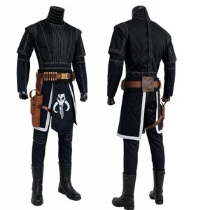 May include: Black costume with white stitching, featuring a high-collared top, short sleeves, and matching pants. A brown belt with ammunition and a holster, plus a black and white graphic on the skirt. Black boots complete the outfit.