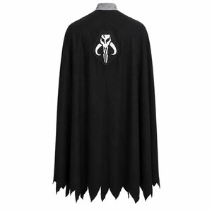 May include: A black cape featuring a grey collar and a white Mythosaur skull emblem centered on the upper back. The hem of the cape is cut into a jagged, pointed design, creating a distinct silhouette. The fabric appears solid and opaque.