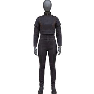 May include: A dark gray two-piece outfit displayed on a mannequin. The outfit includes a long-sleeved, cropped jacket with a high collar and matching pants. The jacket has a layered design, and the pants are fitted. The outfit is made of a textured fabric.