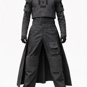 May include: A dark gray futuristic outfit, featuring a cropped top with a geometric design, long-sleeved underlayer, and high-waisted pants with quilted knee pads and pockets. The outfit includes a long skirt-like panel and black gloves and shoes.
