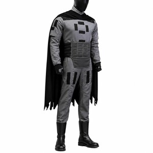 May include: A full-body costume featuring a grey long-sleeved shirt and matching pants with black rectangular patches. The outfit includes a black cape, a wide black waist belt with horizontal stitching, black gloves, and black boots.