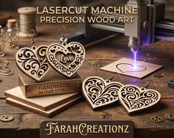May include: Wooden heart-shaped earrings with intricate scrollwork and the word "love" laser-cut into the design. The image also shows a laser cutter in action, creating a heart shape on a wooden surface. The text reads "Laser Cut Machine Precision Wood Art."