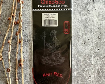 May include: A red circular knitting needle made of stainless steel. The needle is 9 inches (23 cm) long and is size US 1 (2.25 mm). The packaging features the brand name ChiaoGoo and the text "Knit Red".