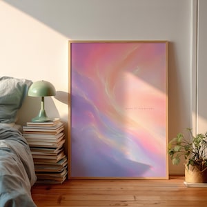 May include: A rectangular framed wall art print featuring a swirling abstract gradient of pink, purple, and orange hues. The text "made of daydreams" is printed in small, light-colored lowercase letters on the right side of the composition.