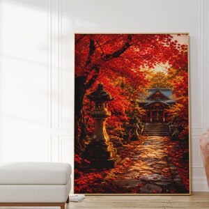 Könnte beinhalten: Ein rechteckiger Wandkunstdruck mit einer lebendigen Herbstszene, leuchtend roten Ahornblättern, einer Steinlaterne und einem Pfad, der zu einem Tempelgebäude führt. Das Kunstwerk ist in einem dünnen Holzrahmen gerahmt und zeigt tiefe Rottöne.