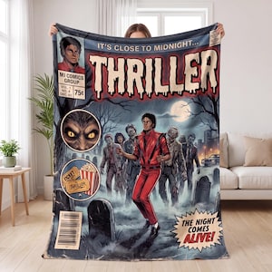 May include: A rectangular throw blanket featuring a comic book cover design titled Thriller. The graphic depicts a person in a red jacket surrounded by zombies in a graveyard at night, with text reading It's Close To Midnight and The Night Comes Alive.