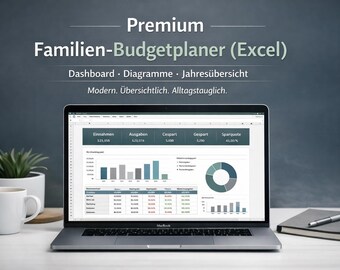 May include: A laptop displaying a financial dashboard with charts and data. The screen shows the text "Premium Familien-Budgetplaner (Excel)". A white mug, a small plant, and a notebook with a pen are on the table.