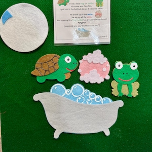 May include: A felt board set featuring a green turtle, a green frog, a white bathtub with blue bubbles, a pink soap shape, and a white moon. A printed card titled Tiny Tim includes the poem: I had a little frog (or turtle) His name was Tiny Tim.