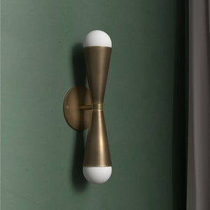 Bowtie wall sconce Mid Century inspired Aged Brass