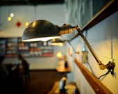 Steel and Brass Wall lamp with parabolic steel shade