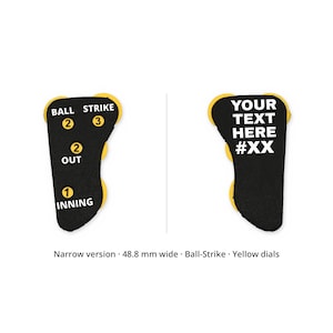 May include: A narrow baseball umpire indicator measuring 48.8 mm wide with yellow dials. The left side features white text for BALL, STRIKE, OUT, and INNING with corresponding numbers. The right side displays the custom text YOUR TEXT HERE #XX.