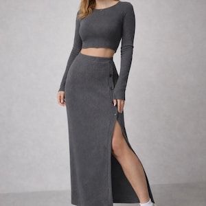 May include: A set of three ceramic nesting bowls in graduating sizes. The bowls feature a speckled, off-white glaze with a slightly textured surface. The largest bowl measures approximately 8 inches in diameter.