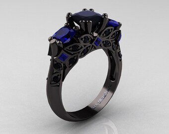 Modern 14K Black Gold Three Stone Blue Sapphire Solitaire