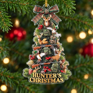 May include: A Christmas tree-shaped ornament featuring a plaid bow at the top and the text HUNTER'S CHRISTMAS at the bottom. The design includes illustrations of deer, ducks, rifles, camouflage gear, and red berries throughout the tree.