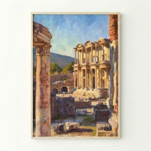 Puede incluir: Una impresión artística de ruinas antiguas, con un edificio clásico con columnas y arcos. La obra de arte tiene una paleta de colores cálidos con tonos beige, marrón y azul, evocando una sensación de historia y belleza arquitectónica. La impresión está enmarcada.