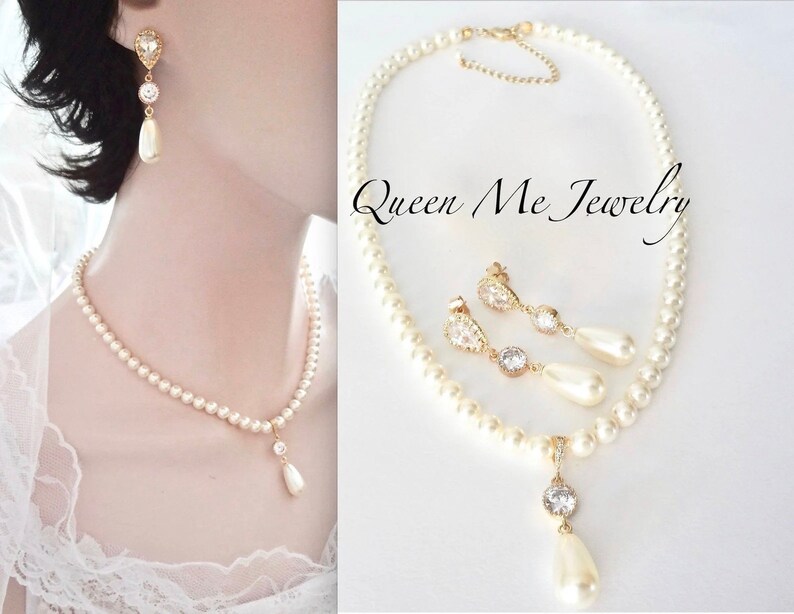 May include: A pearl necklace and matching earrings set. The necklace and earrings feature small, round pearls with a gold-colored pendant and earring accents. The earrings have a teardrop-shaped pearl drop.