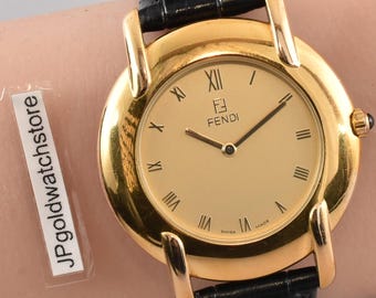 Reloj Fendi 410G unisex vintage con caja, en estado casi impecable, esfera dorada, movimiento de cuarzo con números romanos, años 90.