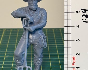 Unpainted G Scale figurine, farmer holding a pitchfork