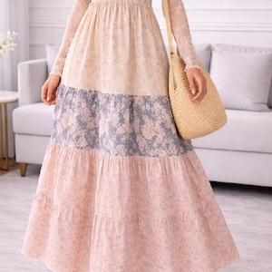 Könnte beinhalten: Set aus drei Keramikbechern mit gesprenkelter, matter Oberfläche. Die Becher sind in Creme-, Hellgrau- und Dunkelgrautönen gehalten. Jede Tasse hat ein schlichtes, minimalistisches Design.