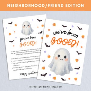 May include: Two white rectangular cards featuring a watercolour ghost, black bats, orange candy corn, and purple stars. The text reads "you've been BOOED!" and "we've been BOOED!" with instructions for a Halloween activity and "Happy Halloween" at the bottom.